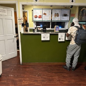Pepe's Place - a man standing at the counter - Seafood Near Me - New Rochelle, New York Pepe's Place - a man standing at the counter - Seafood Near Me - New Rochelle, New York
