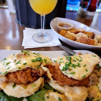 Ruby Slipper Central Business District - The chicken St. Charles & French toast bites (fried chicken breast on a buttermilk biscuit, fried egg, & tasso sauce) - Breakfast & Brunch Near Me - New Orleans, Louisiana Ruby Slipper Central Business District - The chicken St. Charles & French toast bites (fried chicken breast on a buttermilk biscuit, fried egg, & tasso sauce) - Breakfast & Brunch Near Me - New Orleans, Louisiana