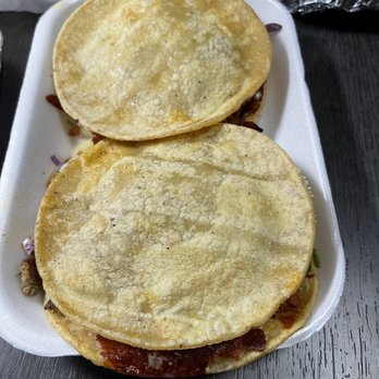 Tacos El Pintor - two tortillas on a plate - Food Trucks Near Me - San Diego, California Tacos El Pintor - two tortillas on a plate - Food Trucks Near Me - San Diego, California