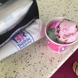 a pink ice cream in a cup