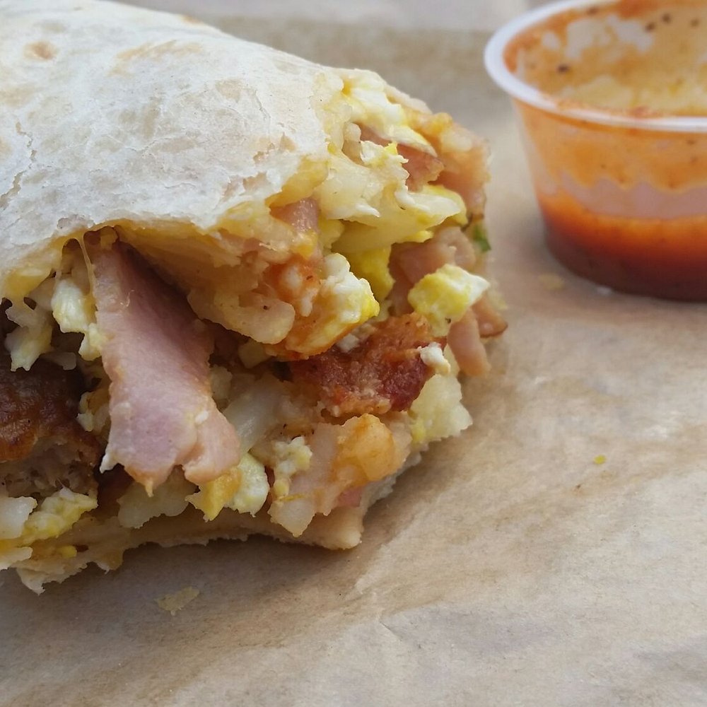 Bread & Butter - Classic Burrito: bacon, ham, sausage, egg, hash brown and cheese with salsa on the side. I already ate half when this pic was taken. - New American Near Me - El Segundo, California