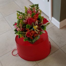 These flowers I sent to my godmother. (I think she just set them on the red bucket for the pic) Ordered & delivered w/in 2 hrs on a Sat morn
