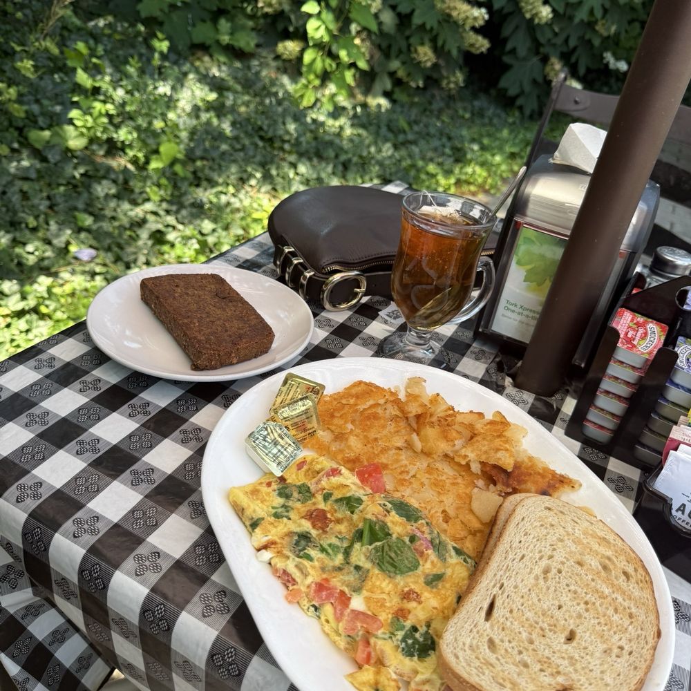 Florentine omelette (spinach, tomato, feta) with homefries and rye toast. Side of scrapple. Florentine omelette (spinach, tomato, feta) with homefries and rye toast. Side of scrapple.