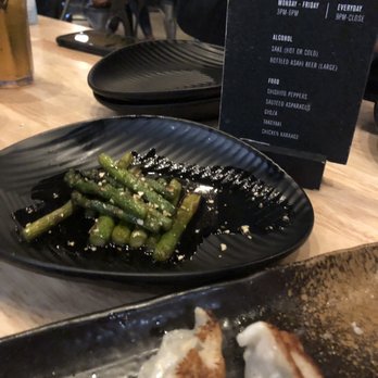 Noods Bar - Happy hour specials = Stir Fried Asparagus and Gyoza. We ended up ordering like 3 orders each cuz it was good - Ramen Near Me - Rancho Cucamonga, California