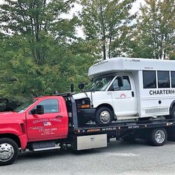 Colonial Towing - "Big Red". Flatbed hauling available.