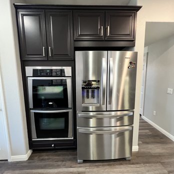 Ecostruct Builders - a kitchen with stainless steel appliances - General Contractors Near Me Ecostruct Builders - a kitchen with stainless steel appliances - General Contractors Near Me