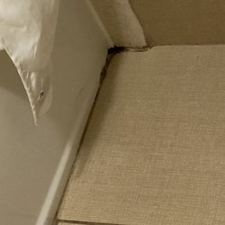 Comfort Inn & Suites Kenosha-Pleasant Prairie - Don't know what black mess that is in the corner next to tub.
