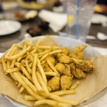 Sunset Pointe - a plate of fried chicken and french fries - Bars Near Me - Fairhope, Alabama