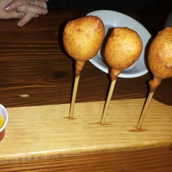 Wrecking Bar Brewpub - Corn Pups (with cup of curried ketchup and yellow mustard) - Brewpubs Near Me - Atlanta, Georgia