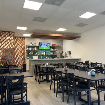 Los Pinos Jalisco - tables and chairs in a restaurant - Bars Near Me - Austin, Texas Los Pinos Jalisco - tables and chairs in a restaurant - Bars Near Me - Austin, Texas