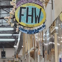 The sign inside the flee market in the back hall for this wonderful shop.