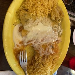 Three enchiladas and double rice. I know it looks plain, but that's on me. I like rice and not beans and no veggies etc. Three enchiladas and double rice. I know it looks plain, but that's on me. I like rice and not beans and no veggies etc.