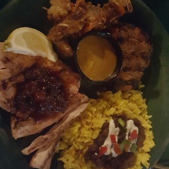 Rae's Coastal Cafe - Trilogy (jerk pork, mahi mahi, & coconut shrimp) with rice & beans - Seafood Near Me - Augusta, Georgia