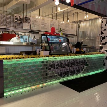 Fugazzi Pizza - a counter with neon lights - Pizza Near Me - Montreal, Quebec