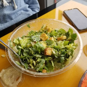 Pizza World - a salad in a bowl on a table - Pizza Near Me - Shrewsbury, Missouri Pizza World - a salad in a bowl on a table - Pizza Near Me - Shrewsbury, Missouri