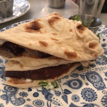 Dishoom - Sausage & egg naan roll - breakfast menu - Indian Near Me - London, XGL Dishoom - Sausage & egg naan roll - breakfast menu - Indian Near Me - London, XGL