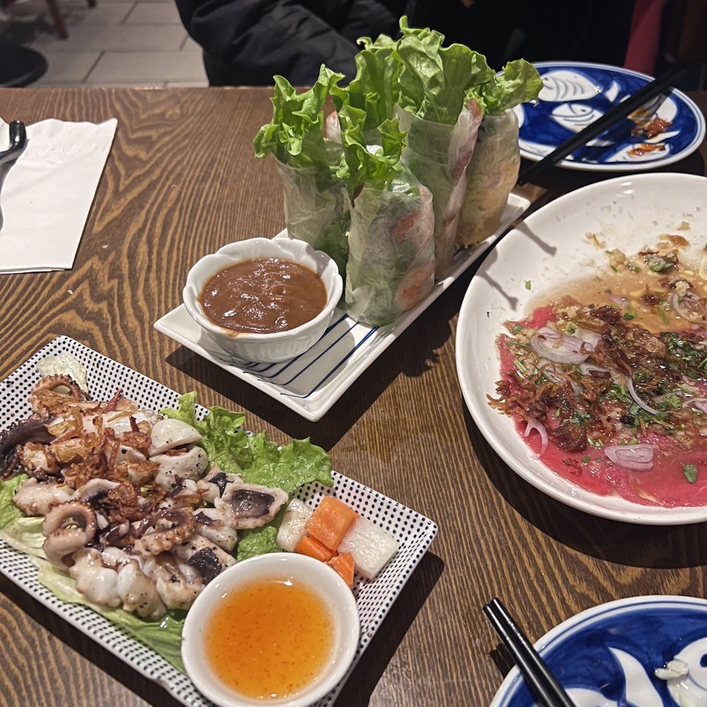 Wooden Fish - Grilled octopus, salad roll trio (classic prawn, nem nuong and shrimp cake) and beef carpaccio - Vietnamese Near Me - West Vancouver, British Columbia Wooden Fish - Grilled octopus, salad roll trio (classic prawn, nem nuong and shrimp cake) and beef carpaccio - Vietnamese Near Me - West Vancouver, British Columbia