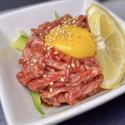 an egg on top of meat an egg on top of meat