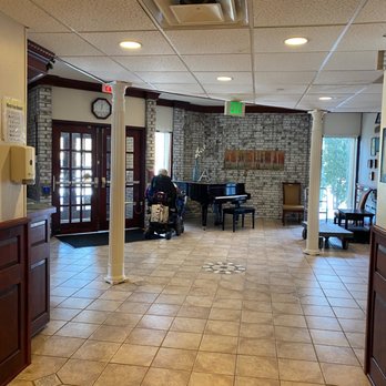 Amberwoods - Main entrance with a piano. - Rehabilitation Center Near Me - Farmington, Connecticut Amberwoods - Main entrance with a piano. - Rehabilitation Center Near Me - Farmington, Connecticut