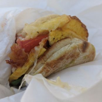Crostini & Java - Image of English breakfast sandwich with egg, spinach leaves, bacon add English muffin. Yum! - Coffee & Tea Near Me - San Francisco, California