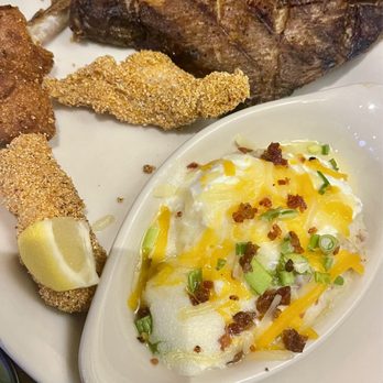 Colton's Steak House & Grill - Ribs and fried catfish dinner with a side of smashed loaded potato - American Near Me - Muskogee, Oklahoma Colton's Steak House & Grill - Ribs and fried catfish dinner with a side of smashed loaded potato - American Near Me - Muskogee, Oklahoma