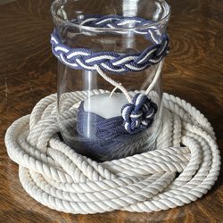 Storm glass with candle. Turks Head Mat.