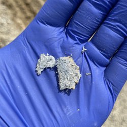 Triton Environmental - Close up of crushed Asbestos Containing Cement Pipe