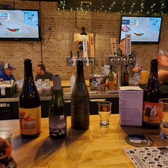 Orange & Brew - a bar with bottles of beer and a bartender - Beer Bar Near Me - Downers Grove, Illinois Orange & Brew - a bar with bottles of beer and a bartender - Beer Bar Near Me - Downers Grove, Illinois