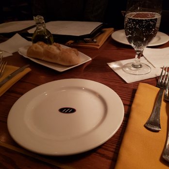 One Eleven Chop House - Table settings, sparkling water - Steakhouses Near Me - Worcester, Massachusetts One Eleven Chop House - Table settings, sparkling water - Steakhouses Near Me - Worcester, Massachusetts