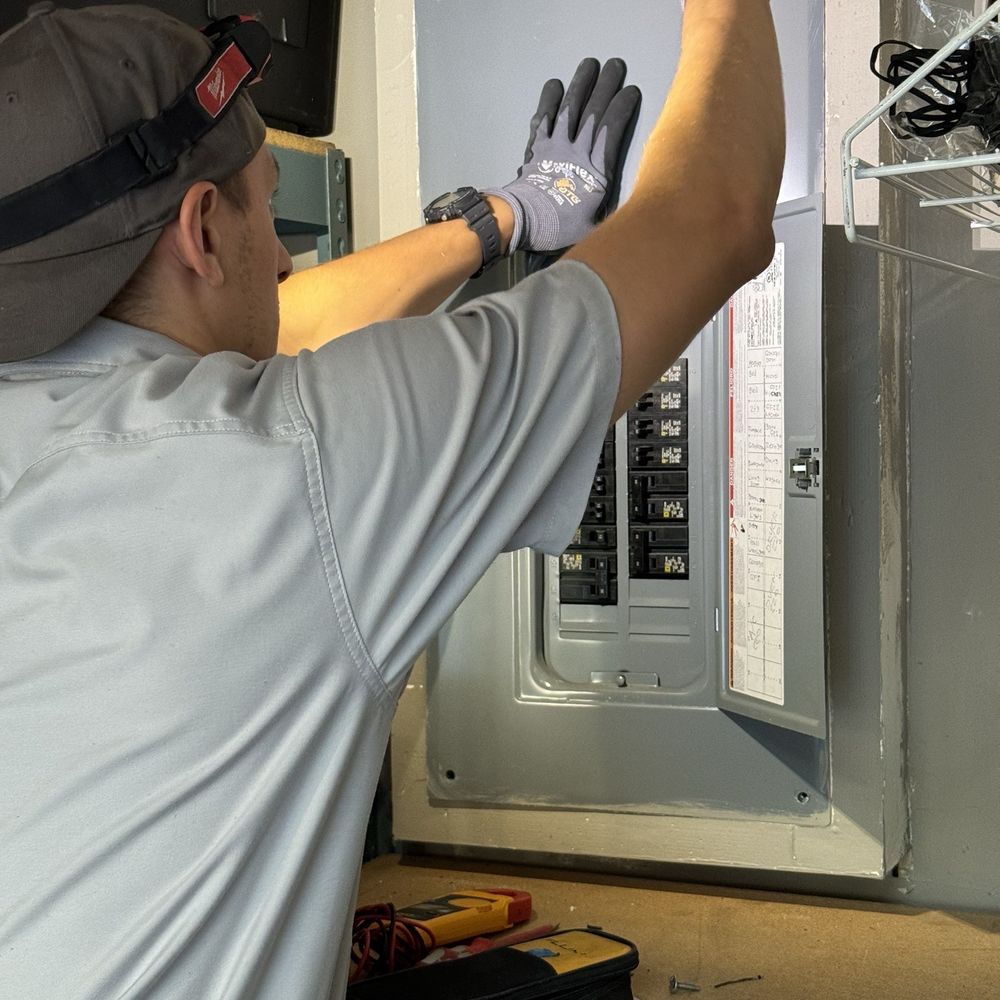 Voltyx - Timur putting back the cover. - Electricians Near Me - Fremont, California Voltyx - Timur putting back the cover. - Electricians Near Me - Fremont, California