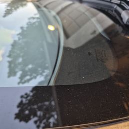 The white specs are not dust or dirty. They are tiny chips all over the windshield. The white specs are not dust or dirty. They are tiny chips all over the windshield.