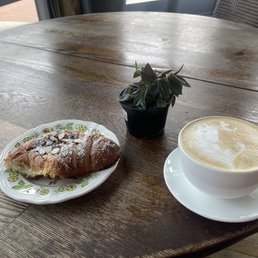 Almond croissant, caramel latte, and a little plant I picked up next door. Almond croissant, caramel latte, and a little plant I picked up next door.