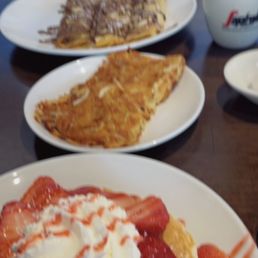 Strawberry pancakes, a side of hashbrown, and chocolate banana-covered crepes. Strawberry pancakes, a side of hashbrown, and chocolate banana-covered crepes.