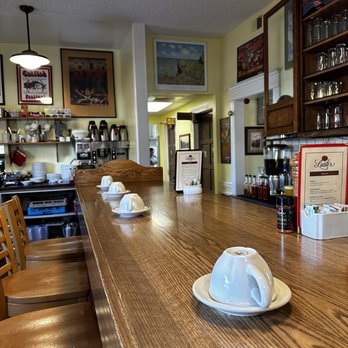 Lucile's Creole Cafe - Bar seating area with coffee cups laid out nicely - Cajun/Creole Near Me - Fort Collins, Colorado