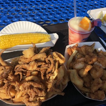 Johnny's Reef Restaurant - Left: calamari w fries Right: shrimp w fries Drink: Miami vice -corn on the cob - Seafood Near Me - Bronx, New York Johnny's Reef Restaurant - Left: calamari w fries Right: shrimp w fries Drink: Miami vice -corn on the cob - Seafood Near Me - Bronx, New York