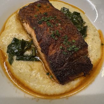 The Revelry - Salmon with cheese grits & garlicky greens - New American Near Me - Rochester, New York The Revelry - Salmon with cheese grits & garlicky greens - New American Near Me - Rochester, New York