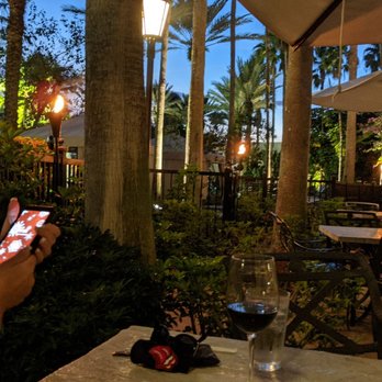 The Kitchen - Dusk with tiki torches - New American Near Me - Orlando, Florida The Kitchen - Dusk with tiki torches - New American Near Me - Orlando, Florida