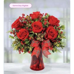 Ava's Flowers - This is what they advertised. To this I added a dozen white roses. Note the red vase and ribbon.