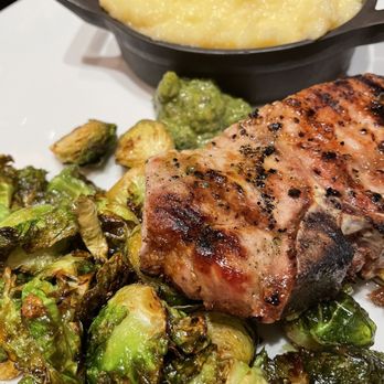 Morgan's On Main - Shared pork porterhouse with polenta and roasted Brussel sprouts - New American Near Me - Woodland, California Morgan's On Main - Shared pork porterhouse with polenta and roasted Brussel sprouts - New American Near Me - Woodland, California