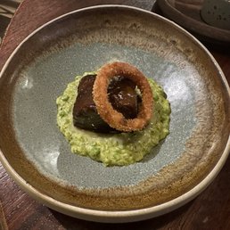 Borders' ox cheek, pea & basil risotto, crispy onion