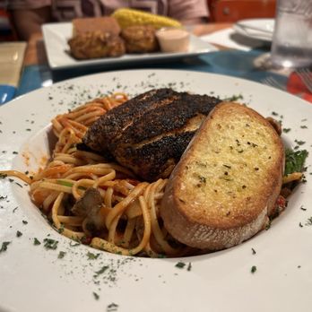 Michael's Seafood Restaurant - Special: Blackened Swordfish and Spicy Linguini with mushroom and spinach with a side of garlic bread - Seafood Near Me - Carolina Beach, North Carolina Michael's Seafood Restaurant - Special: Blackened Swordfish and Spicy Linguini with mushroom and spinach with a side of garlic bread - Seafood Near Me - Carolina Beach, North Carolina