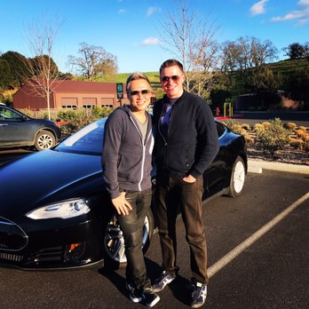 Unique Wine Experience - two men standing in front of a black car - Wineries Near Me Unique Wine Experience - two men standing in front of a black car - Wineries Near Me