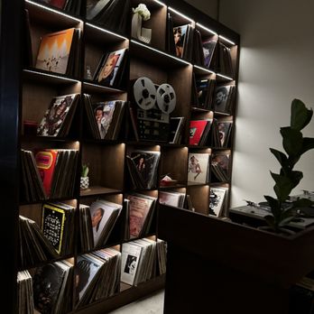 SEVEN:45 - a wall of record shelves - Speakeasies Near Me - Las Vegas, Nevada