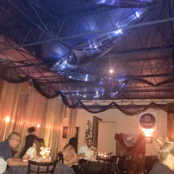 Penumbra - The main dining area. My flash has it looking much much brighter that how it really is. - Wine Bars Near Me - Chicago, Illinois