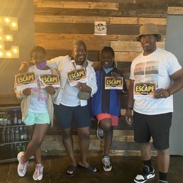 Family having a great experience at Escape Room Co. Family having a great experience at Escape Room Co.