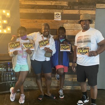 The Escape Company - Family having a great experience at Escape Room Co. - Escape Games Near Me - Orlando, Florida The Escape Company - Family having a great experience at Escape Room Co. - Escape Games Near Me - Orlando, Florida