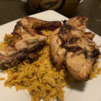 Nando's Peri-Peri - 1/2 chicken, 1 sm and 1 lg Portuguese rice delivered, plated - South African Near Me - Oakbrook, Illinois