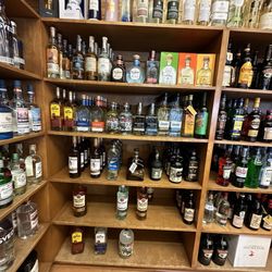 Dornans - Rum display amid an array of varying liquors