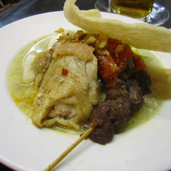 Sie-Joe - Lontong Special (rice cake in coconut milk topped with chicken and vegetables and pork satay) - Indonesian Near Me - Amsterdam, New Hampshire Sie-Joe - Lontong Special (rice cake in coconut milk topped with chicken and vegetables and pork satay) - Indonesian Near Me - Amsterdam, New Hampshire