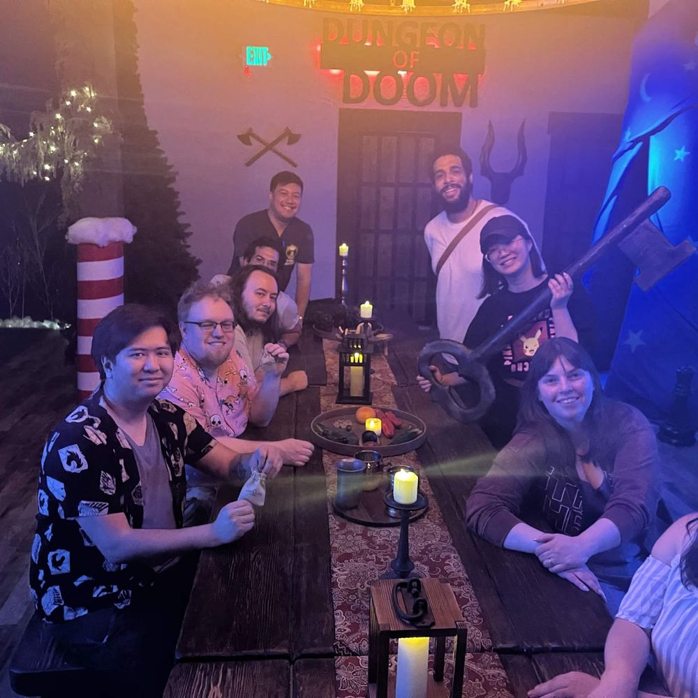 Sure Lock Escapes - Group photo at their cool table - Escape Games Near Me - Kent, Washington Sure Lock Escapes - Group photo at their cool table - Escape Games Near Me - Kent, Washington